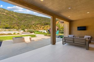 545 Ledge Street San Marcos covered outdoor living room with fireplace and backyard views
